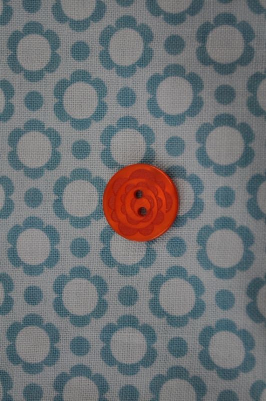 Knopf Blumenkreis klein orange