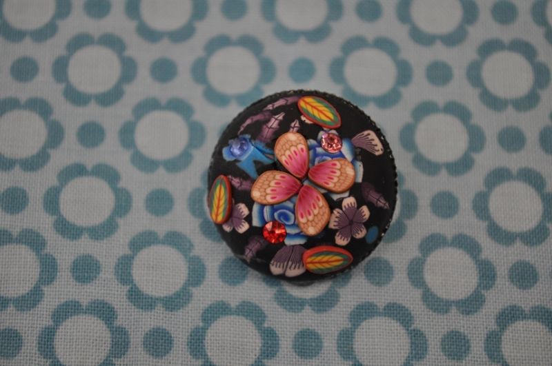Knopf Blume Metall 3d schwarz strass