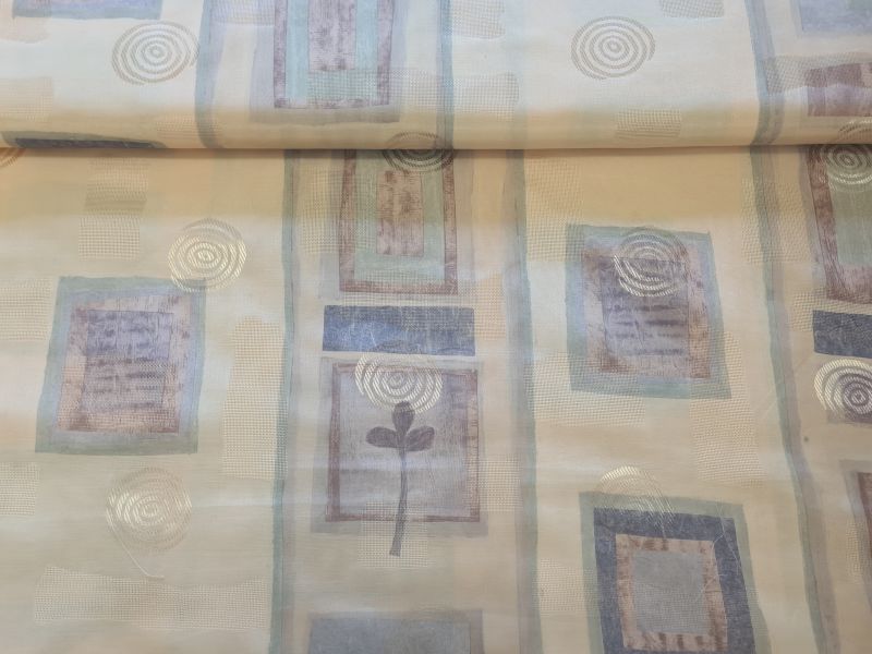 Leichter Dekostoff mit gold glänzenden Kringeln