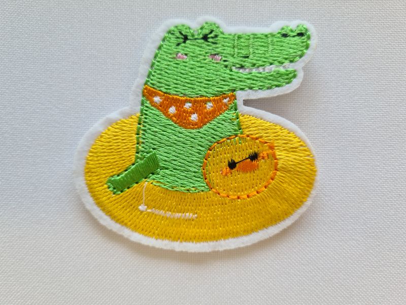 Applikation/Bügelbild Krokodil im Schwimmring