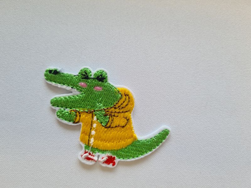 Applikation/Bügelbild Krokodil im Regenmantel
